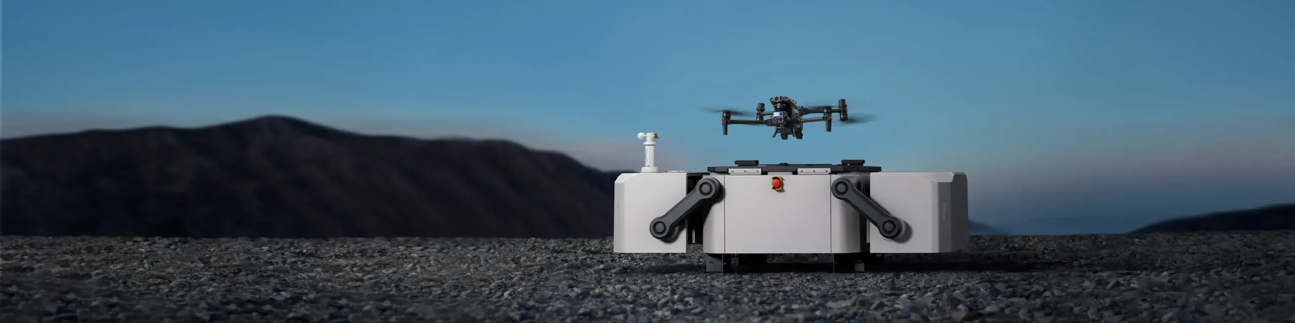Camera drone flying at sunset