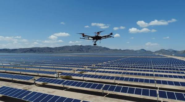 DJI enterprise drone inspecting solar panels and wind turbines across Africa
